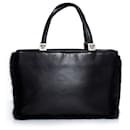 Gianni Versace, Vintage black leather handbag with fur