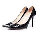 Jimmy Choo, Patent leather pumps in black.