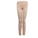 7 For All Mankind, Beige trousers with ornamental print.