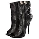 Giuseppe Zanotti, black leather peep-toe ankle boots with silver zippers in size 38.5.