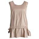 Marni, beige top with open back.