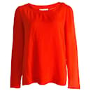 Chloe, orange top with golden buttons. - Chloé