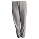 VICTORIA BECKHAM, Grey jogging trousers with yellow details in size 3/l. - Victoria Beckham