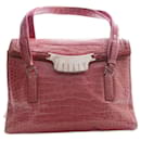 Prada, bolsa tiracolo em couro de crocodilo rosa com detalhes prateados.