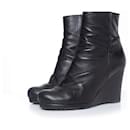 Prada, Black leather wrinkled wedge ankle boots