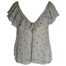 Blusa plisada con cuello en V Ganni en poliéster reciclado color crema