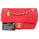 Beautiful Chanel bag 21 cm in leather and Chevron pattern Valentine Red.