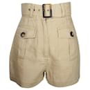 Pantalones cortos de lino beige con cinturón y cintura alta de Zimmermann