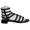 Flache Gladiator-Sandalen von Stuart Weitzman aus schwarzem Leder