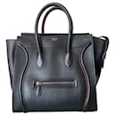 Céline Luggage in black leather and burgundy edges