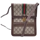Bolsa de ombro vertical em lona com monograma vintage e listras - Gucci