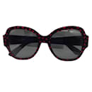 Saint Laurent schwarz / Sonnenbrille mit rotem Kunststoffrahmen und Herzmuster