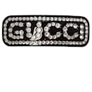 Black hair-clasp from Gucci embellished with white rhinestone