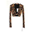 Blusa cropped com estampa barroca de manga longa Versace.