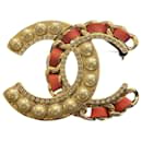 Chanel metal leather brooch