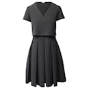 Maje Pleated Skirt Mini Dress in Black Polyester