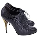Giuseppe Zanotti Lace-Up Quilted High Heel Ankle Boots in Black Patent Leather