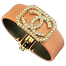 Chanel leather bracelet, Golden metal, faux pearls and rhinestones