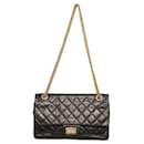 Chanel 2.55 Reissue 225 lined Flap Bag in Black with gold tone hardware small