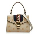 Bolso satchel con asa superior y estrella Gucci Mini Sylvie Bee en beige