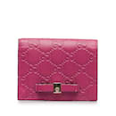 Rosafarbene Gucci Guccissima-Brieftasche mit Schleife