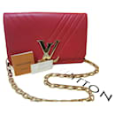 Louis Vuitton Red Leather Airy V chain bag clutch pochette calfskin embossed.