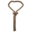 Colar Chanel com gravata em bronze dourado