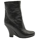 Miu Miu Wedge Ankle Boots in Black Leather