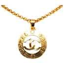 Collier pendentif rond Chanel CC doré
