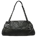 Chanel Just Mademoiselle Mini Bowler Bag aus schillerndem schwarzem Leder