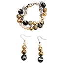 Bellissima luminosa parure acciaio dorato e perle bracciale più orecchini DOLCE & GABBANA con, perle bianche, oro e nere - Dolce & Gabbana