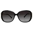 Gafas de sol polarizadas redondas negras Gucci