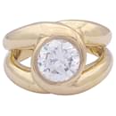 Yellow gold intertwined ring set with a diamond. - inconnue