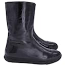Miu Miu Mid-Calf Flat Boots in Black Patent Calf Leather