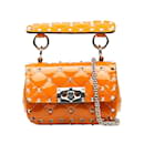 Bolso satchel Rockstud Spike de microcharol Valentino naranja