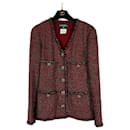 Jaqueta de tweed Lesage com botões de joia por 9 mil dólares. - Chanel
