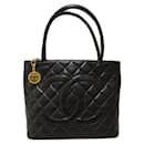 Borsa tote con medaglione CC Caviar A01804 - Chanel