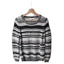 Suéter de lã listrado preto e branco de Sandro