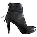 Black leather boots or ankle boots, size 37.5, with ankle strap and a tassel. - Autre Marque