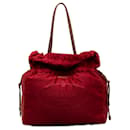 Prada – Tessuto-Einkaufstasche mit Kordelzug und rotem Logo