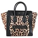 Minibolso de equipaje CELINE de piel negra y pelo de potro con estampado de leopardo - Céline