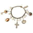 Magnifique bracelet vintage rare DOLCE & GABBANA en acier doré avec camée croix et divers charms - Dolce & Gabbana