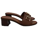 Louis Vuitton Lock It Mules in Brown Calfskin Leather