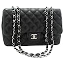 Black 2009 jumbo caviar Classic single flap bag - Chanel