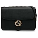 Bolso bandolera Gucci mediano Dollar con G entrelazadas en negro