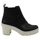 Contemporary Designer Black Leather Boots With White Platform Heel - Autre Marque