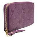 Portefeuille Zippy en relief monogramme violet Louis Vuitton