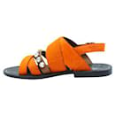 Marni – Flache Sandalen aus orangefarbenem Ponyhaar