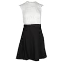 Weißes und schwarzes Kleid mit Spitzenstickerei - Sandro