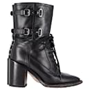 Valentino Garavani Rockstud Double-Buckle Heeled Boots in Black Leather